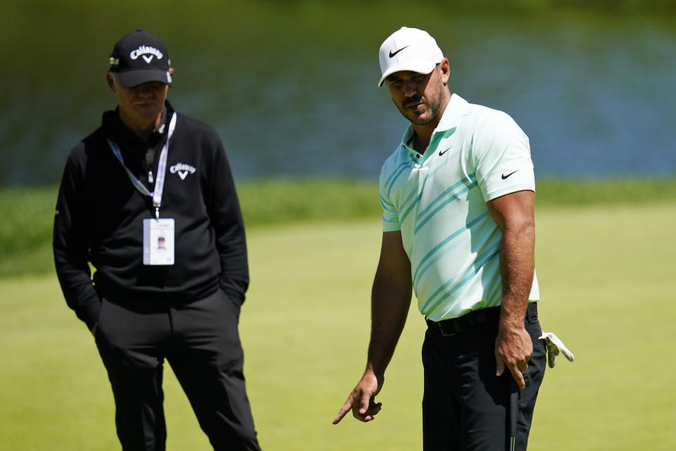 Brooks Koepka reacts to a putt on the 13th hole during a practice round for the U.S. Open golf tournament at The Country Club, Wednesday, June 15, 2022, in Brookline, Mass. (AP Photo/Julio Cortez)