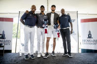 From left, Howard University Athletic Director Kery Davis, Howard student Otis Ferguson, Golden State Warriors guard Stephen Curry, and Howard University president Wayne Frederick pose for photographs together following a news conference at Langston Golf Course in Washington, Monday, Aug. 19, 2019, where Curry announced that he would be sponsoring men's and women's golf teams at Howard University. Ferguson's suggestion that they play golf during a visit by Curry to Howard earlier this year lead to this announcement. (AP Photo/Andrew Harnik)