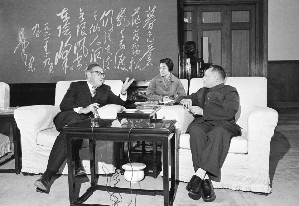 FILE - Then Chinese Premier Deng Xiaoping, right, listens as then U.S. Secretary of State Henry Kissinger speaks during their meeting in Beijing, Nov. 27, 1974. Official China called Kissinger “an old friend.” A commentator likened him to a giant panda, a goodwill ambassador between two countries that have been more often at odds over the decades than not. Kissinger, who died Wednesday, Nov. 29, 2023, developed a special relationship with China in the second half of his 100-year-long life. (AP Photo, File)