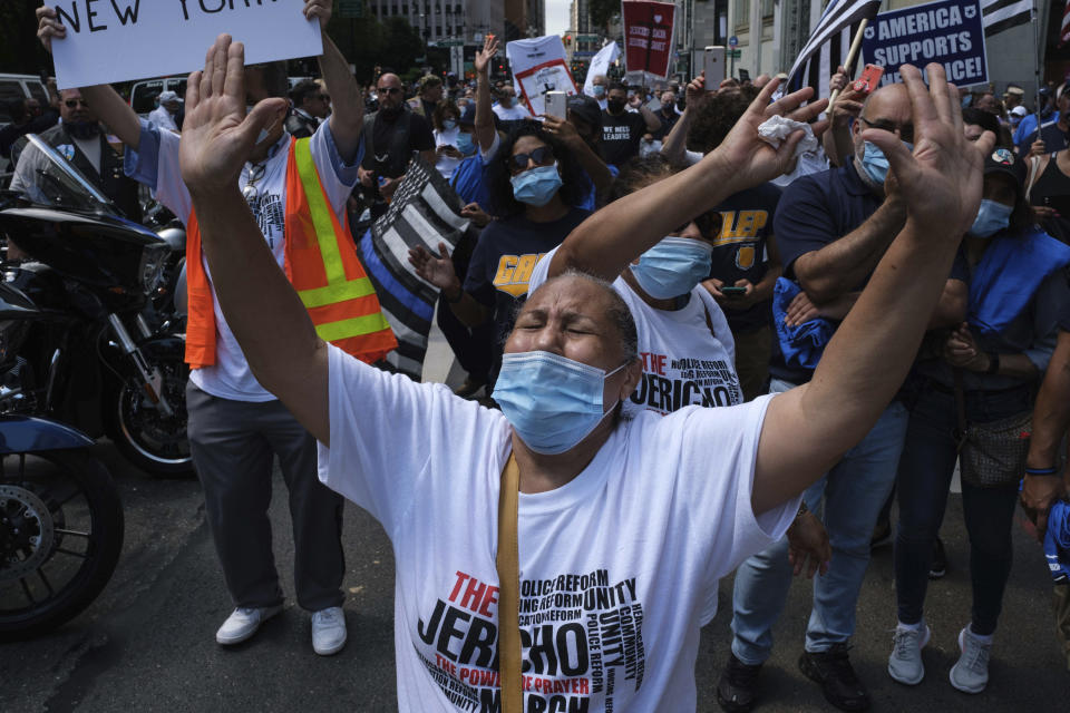 Attendee of Pro-NYPD demonstration dance near New York City Hall, Wednesday, July 15, 2020, in New York. (AP Photo/Yuki Iwamura)