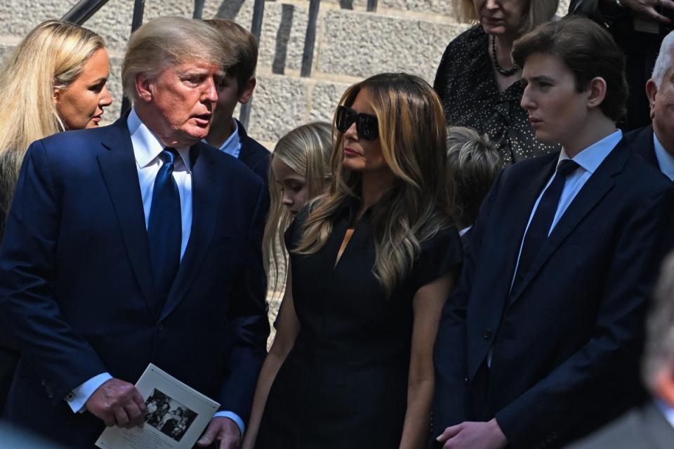 Donald Trump, Melania Trump and Barron Trump exit the funeral of Ivana Trump in July 2022 (Getty Images)