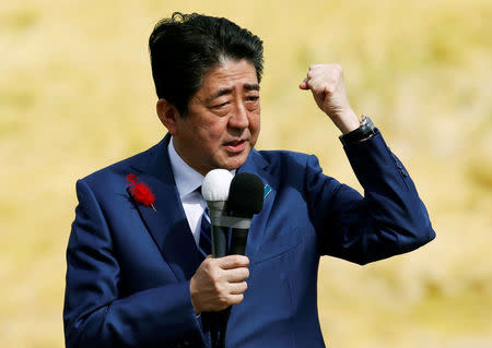 FILE PHOTO - Japan's Prime Minister Shinzo Abe, who is also ruling Liberal Democratic Party leader, attends an election campaign rally in Fukushima, Japan, October 10, 2017. REUTERS/Toru Hanai