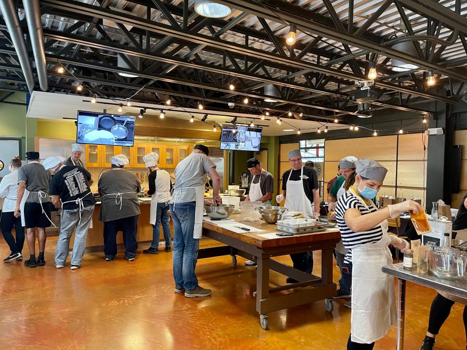 Participants dig in during a cooking class at Milwaukee Public Market.