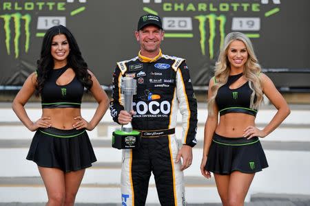 May 17, 2019; Concord, NC, USA; NASCAR Cup Series driver Clint Bowyer (14) celebrates after winning the pole for the Monster Energy All-Star Race at Charlotte Motor Speedway. Mandatory Credit: Jasen Vinlove-USA TODAY Sports