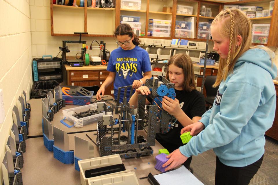 From left to right: Ava Costine, Tatum Wright and Lainey Hermanson work on their robot on Monday, April 15, 2024 at Good Shepherd Lutheran School.