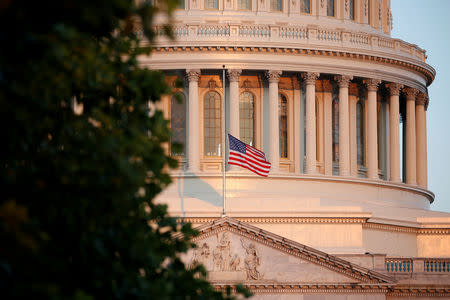 A flag flies at half-staff in honor of Senator John McCain (R-AZ) at the U.S. Capitol in Washington, U.S., August 26, 2018. REUTERS/Joshua Roberts