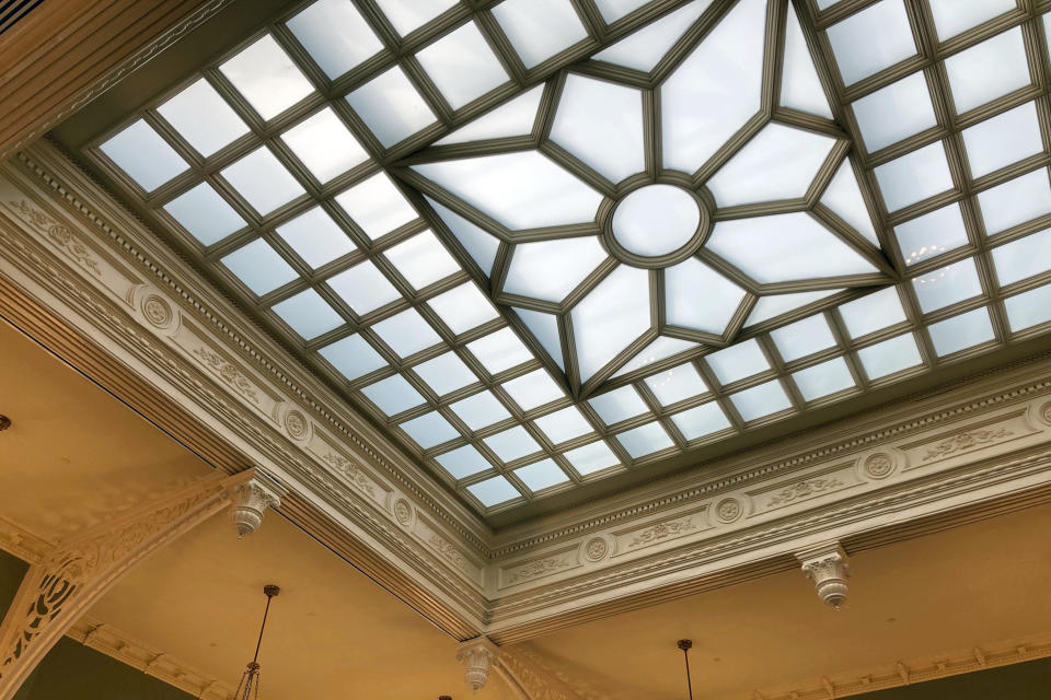 Skylights, that had been totally covered by plaster ceilings have been exposed and refurbished, illuminate the refurbished interior of New Jersey statehouse, Wednesday March 22, 2023, in Trenton, N.J. The building has been reopened and reoccupied by the governor's and other executive staff after a nearly six year, $300-million renovation. (AP Photo/Mike Catalini)