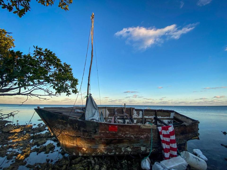 A homemade boat used by Cuban migrants to reach the United States sits off shore at Harry Harris Park in Tavernier, in the Florida Keys, on Jan. 14, 2023.