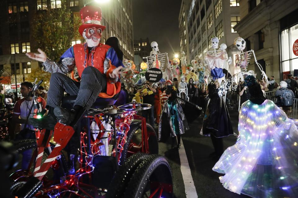 Revelers march during the Greenwich Village Halloween Parade, Thursday, Oct. 31, 2019, in New York. (AP Photo/Frank Franklin II)