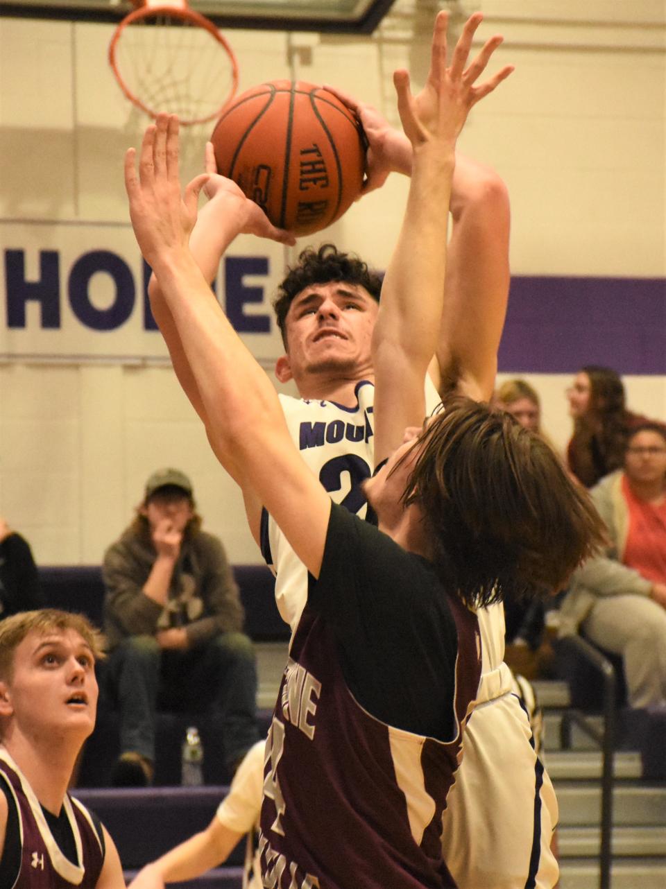Derek Milianta goes back up with a shot after grabbing an offensive rebound for Little Falls during the Mounties' Section III playoff victory over Sherburne-Earlville Wednesday.
