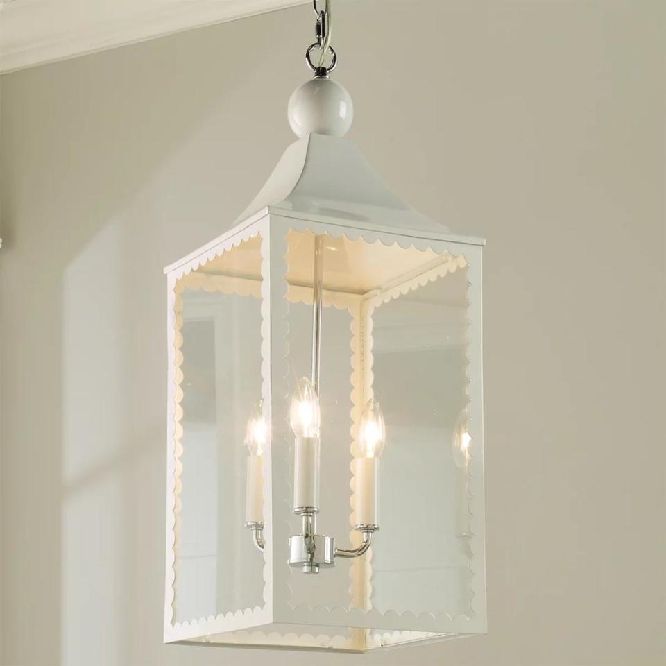 <p><a href="https://www.shadesoflight.com/products/scallop-trim-hanging-lantern-1" rel="nofollow noopener" target="_blank" data-ylk="slk:Shop Now;elm:context_link;itc:0;sec:content-canvas" class="link ">Shop Now</a></p><p>Scallop Trim Hanging Lantern</p><p>shadesoflight.com</p><p>$345.00</p>