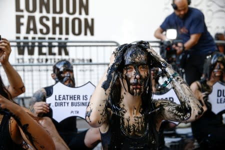 Activists from PETA stage a demonstration outside a venue during London Fashion Week in London