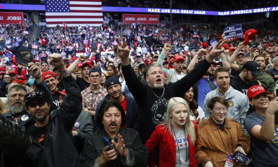 Supporters cheer before a rally in Grand Rapids, Michigan on 28 March.