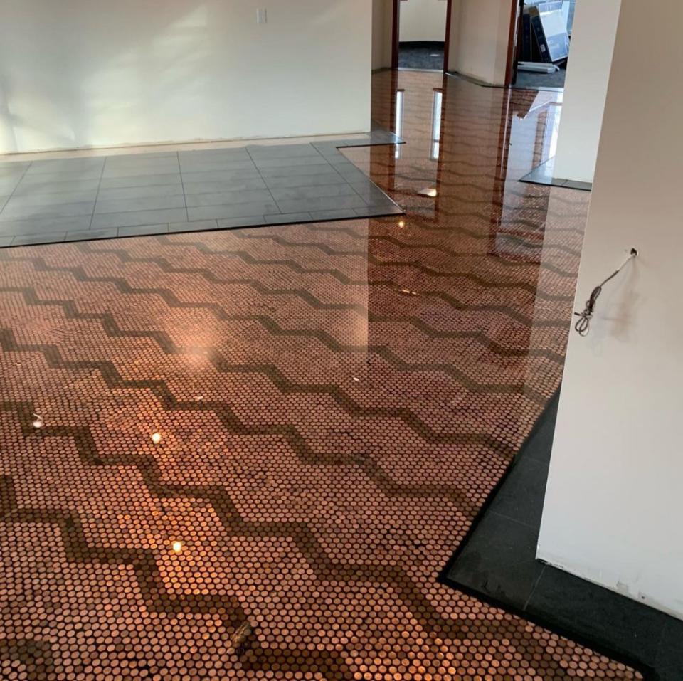 a hallway with a tile floor