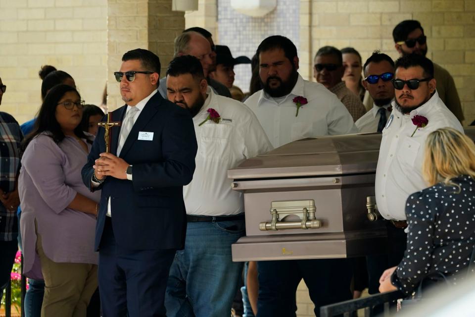 Pallbearers carry the casket of Amerie Jo Garza following funeral services at Sacred Heart Catholic Church in Uvalde, Texas.