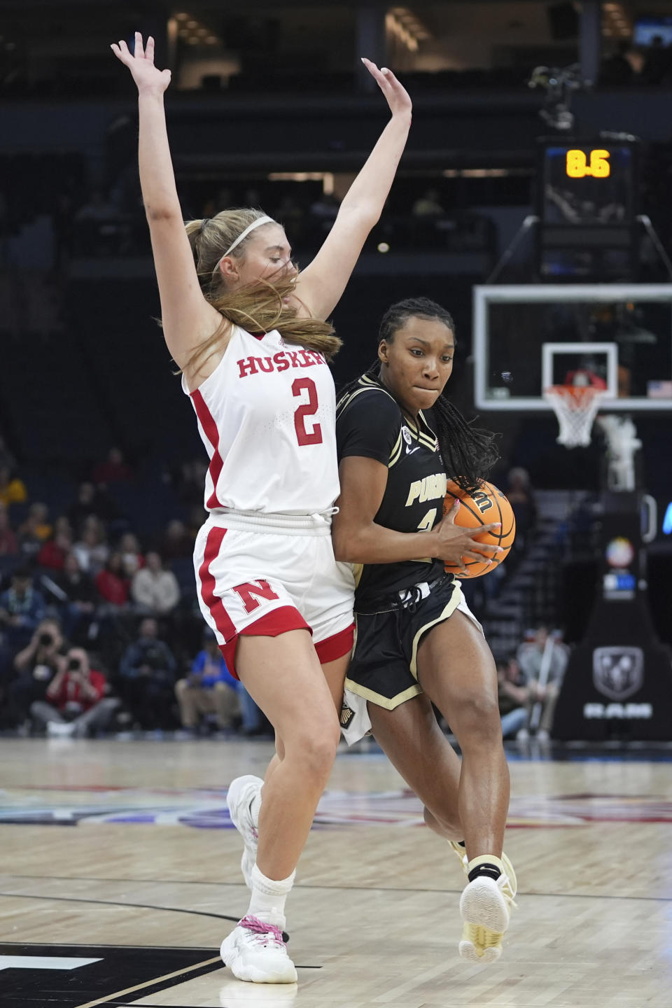 Purdue guard Rashunda Jones works toward the basket as Nebraska guard Logan Nissley (2) defends during the first half of an NCAA college basketball game at the Big Ten women's tournament Thursday, March 7, 2024, in Minneapolis. (AP Photo/Abbie Parr)