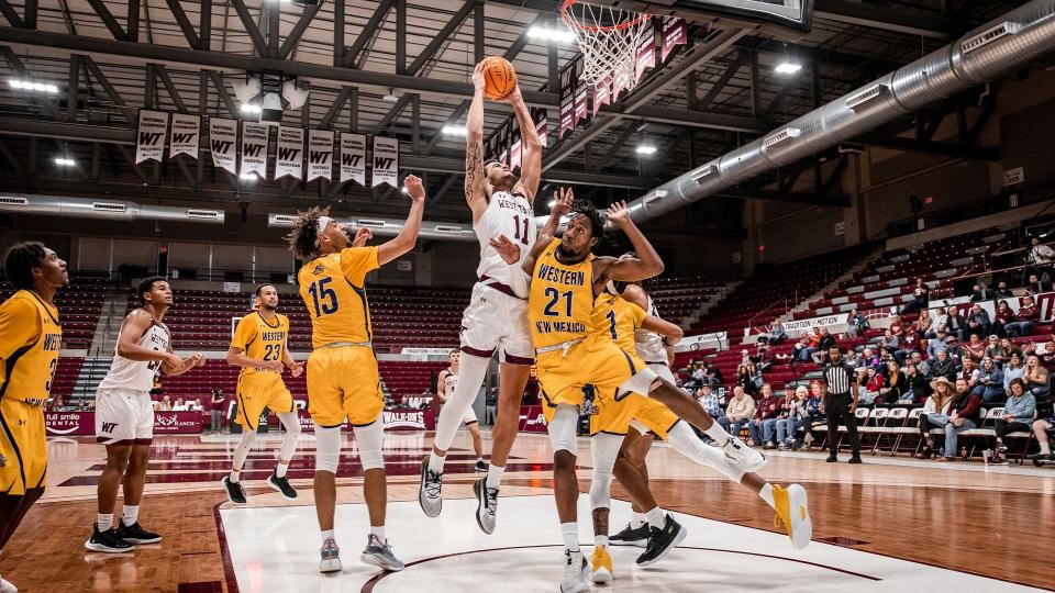 Kavon Booker (11) attacks the basket during West Texas A&M's 73-70 win over Western New Mexico last Saturday at First United Bank Center in Canyon. He was named the Lone Star Conference Defensive Player of the Week on Monday.
