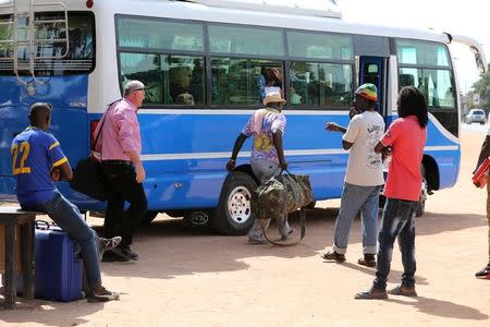Tourists are seen as they board a bus leaving for the airport a day after the country declared a state of emergency, in Banjul, Gambia January 18, 2017. REUTERS/Afolabi Sotunde
