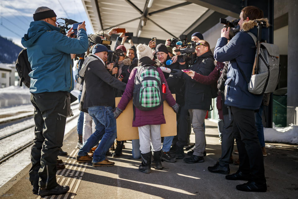 FILE - In this Wednesday, Jan. 23, 2019 file photo 16 year-old Swedish climate activist Greta Thunberg is surrounded by journalists as she arrives to attend the 49th Annual Meeting of the World Economic Forum, WEF, in Davos, Switzerland. In a wide-ranging monologue on Swedish public radio, teenage climate activist Greta Thunberg recounts how world leaders queued up to have their picture taken with her even as they shied away from acknowledging the grim scientific fact that time is running out to curb global warming. (Valentin Flauraud/Keystone via AP, file)
