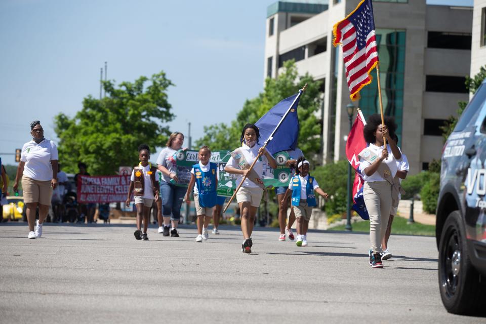 Members of Girl Scout group 7217 lead the way during the 2021 Juneteenth parade through downtown Topeka.