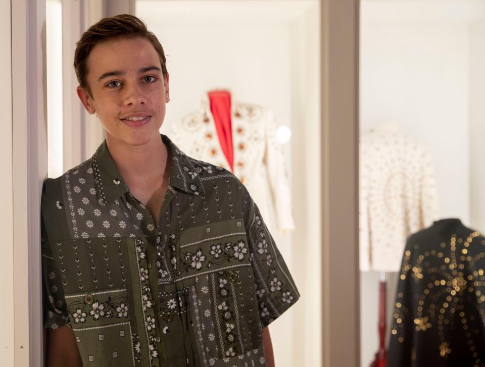 Chaydon Jay, the young Australian actor who plays the boy Elvis in the new biopic, poses in the 'Dressed to Rock' exhibit Friday, July 8, 2022, at Graceland in Memphis. The room features clothing from 1969-1977 worn by Elvis Presley. 