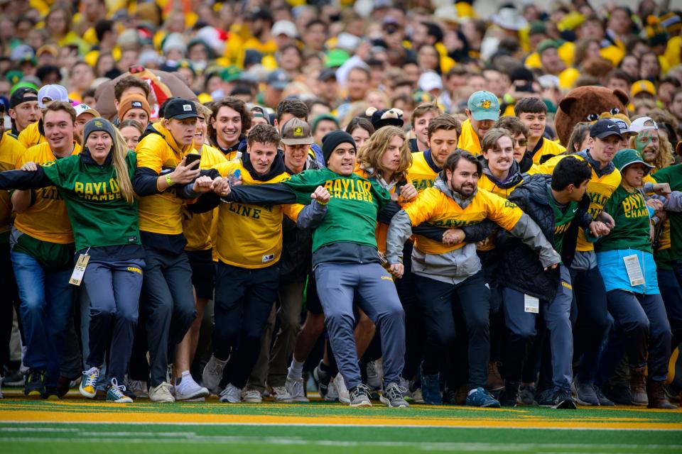 Students part of the Baylor Line prepares to run onto the field before the school's game against Texas Tech at McLane Stadium.