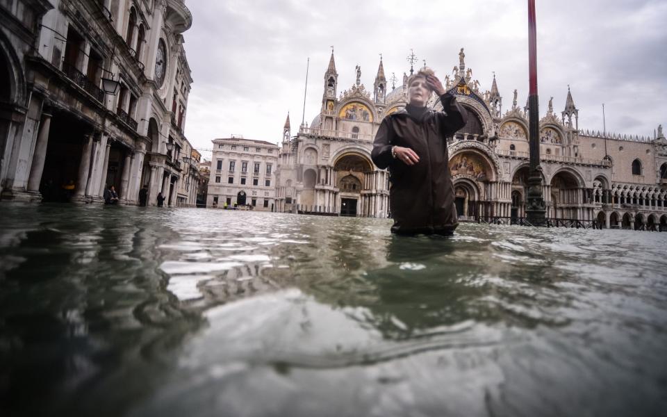 St Mark's Square was closed on Friday for safety reasons as the flood reached 1.6m - AFP