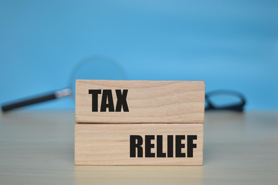 Wooden blocks with the words TAX RELIEF, illustrating a story on CPF top-ups and tax relief.
