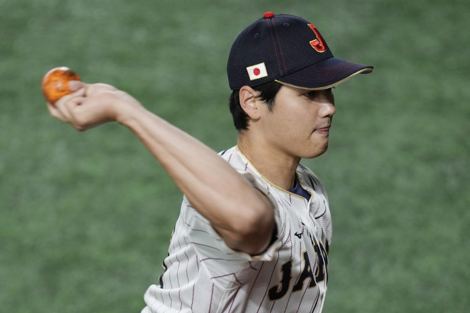 Japan's Shohei Ohtani, warms up during an official training session prior to the Pool B game at the World Baseball Classic (WBC) at the Tokyo Dome Wednesday, March 8, 2023, in Tokyo. (AP Photo/Eugene Hoshiko)