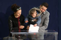 Patryk Jaki, United Right candidate for mayor of Warsaw, accompanied by his wife and son casts a vote during the Polish regional elections, at a polling station in Warsaw, Poland, October 21, 2018. Slawomir Kaminski/Agencja Gazeta via REUTERS