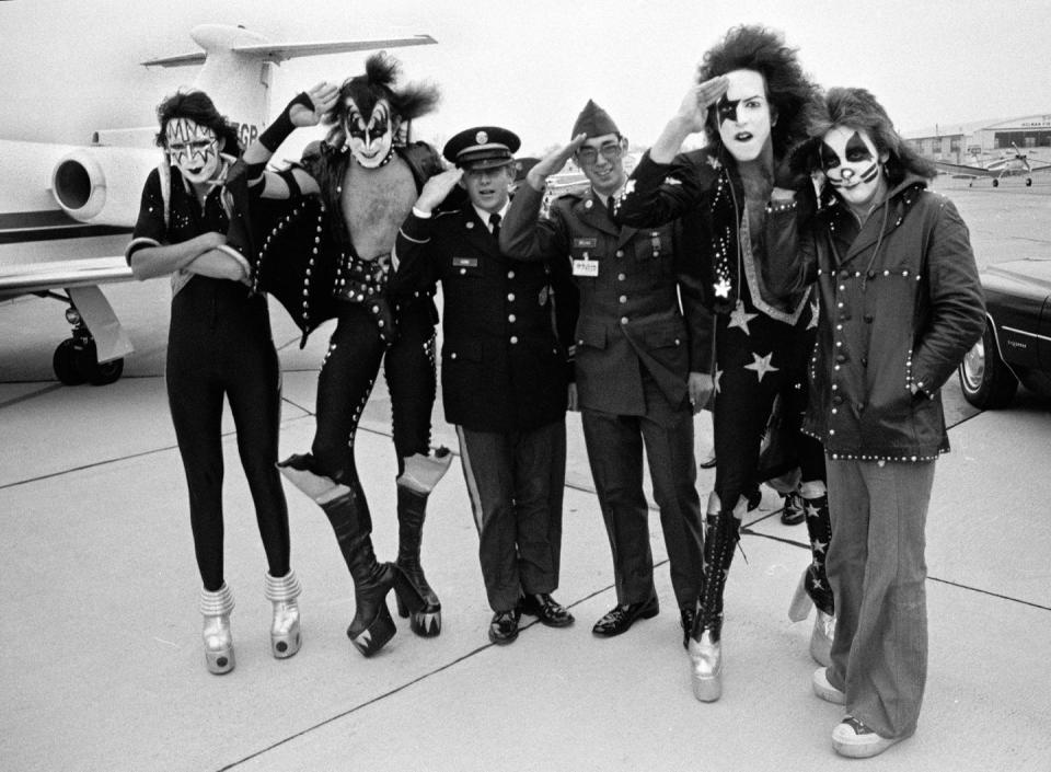 <p>KISS salutes with military officers in 1975. </p>