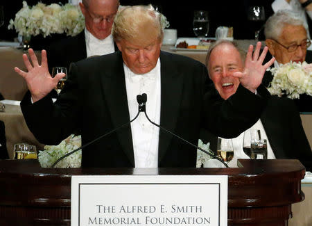 Republican U.S. presidential nominee Donald Trump makes a joke about hand size at the Alfred E. Smith Memorial Foundation dinner in New York, U.S. October 20, 2016. REUTERS/Jonathan Ernst