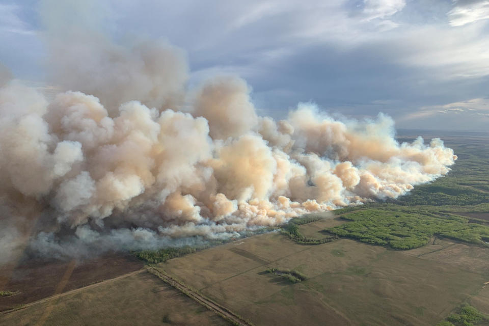 Smoke rises from mutual aid wildfire in the Grande Prairie Forest Area