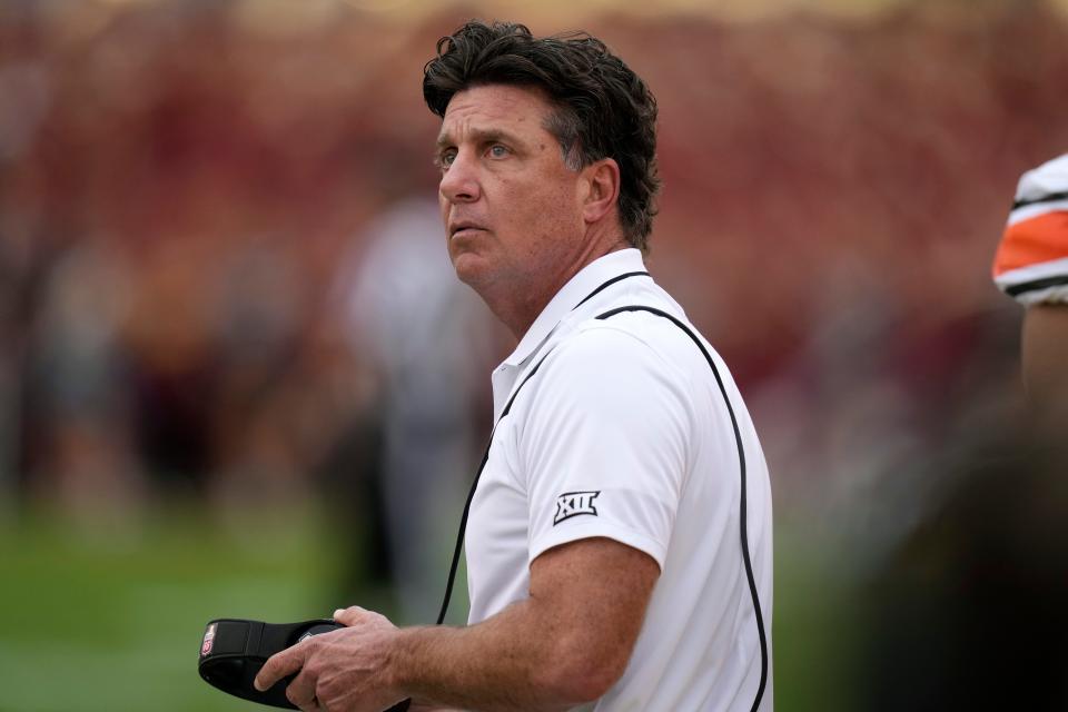 Oklahoma State coach Mike Gundy watches from the sideline during the first half of Saturday's game against Iowa State in Ames, Iowa.