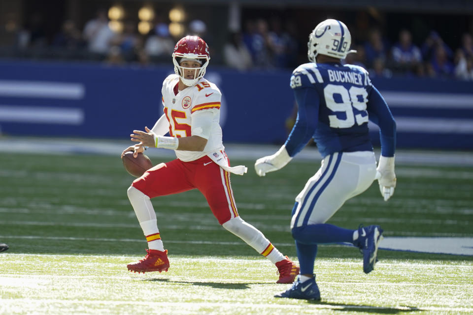 Kansas City Chiefs quarterback Patrick Mahomes throws against Indianapolis Colts' DeForest Buckner during the second half of an NFL football game, Sunday, Sept. 25, 2022, in Indianapolis. (AP Photo/Michael Conroy)