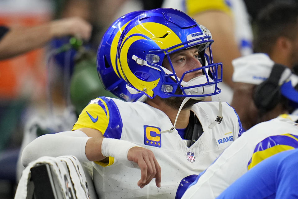 Los Angeles Rams quarterback Matthew Stafford watches from the bench with a bandage on his throwing hand during the second half of an NFL football game against the Dallas Cowboys Sunday, Oct. 29, 2023, in Arlington, Texas. (AP Photo/Julio Cortez)