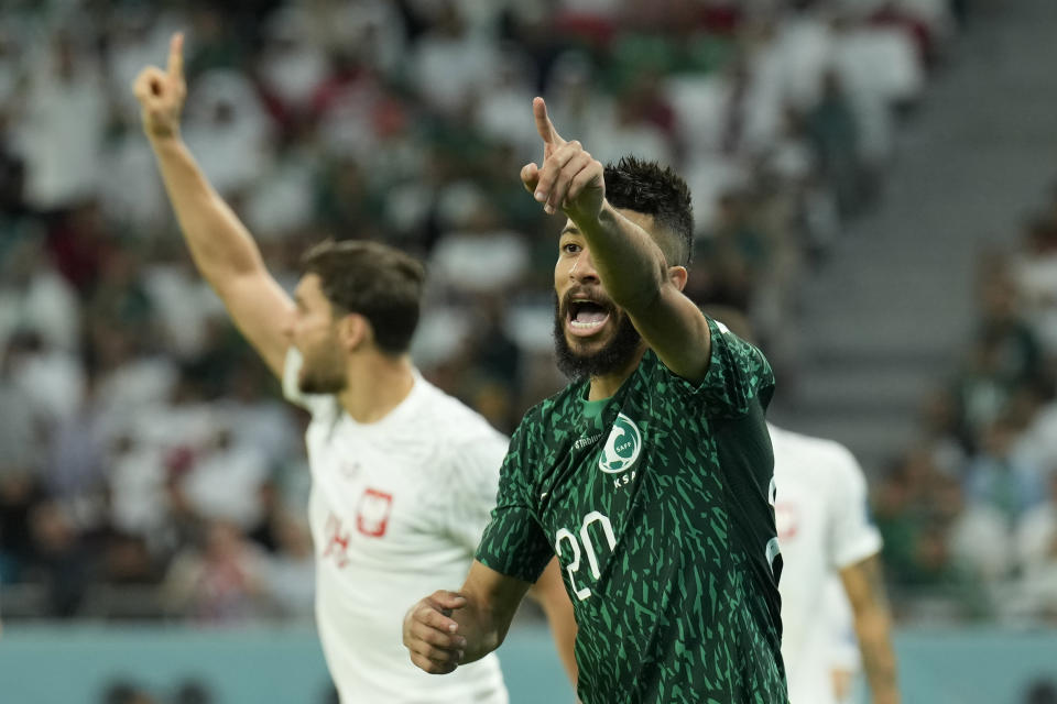 Saudi Arabia's Abdulrahman Al-Aboud gestures to the linesman during the World Cup group C soccer match between Poland and Saudi Arabia, at the Education City Stadium in Al Rayyan , Qatar, Saturday, Nov. 26, 2022. (AP Photo/Francisco Seco)