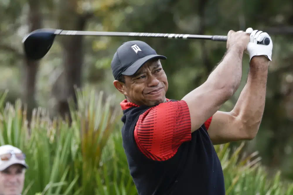 Tiger Woods tees off of the 3rd hole during the final round of the PNC Championship golf tournament on Dec. 18, 2022, in Orlando, Fla. (AP Photo/Kevin Kolczynski, File)