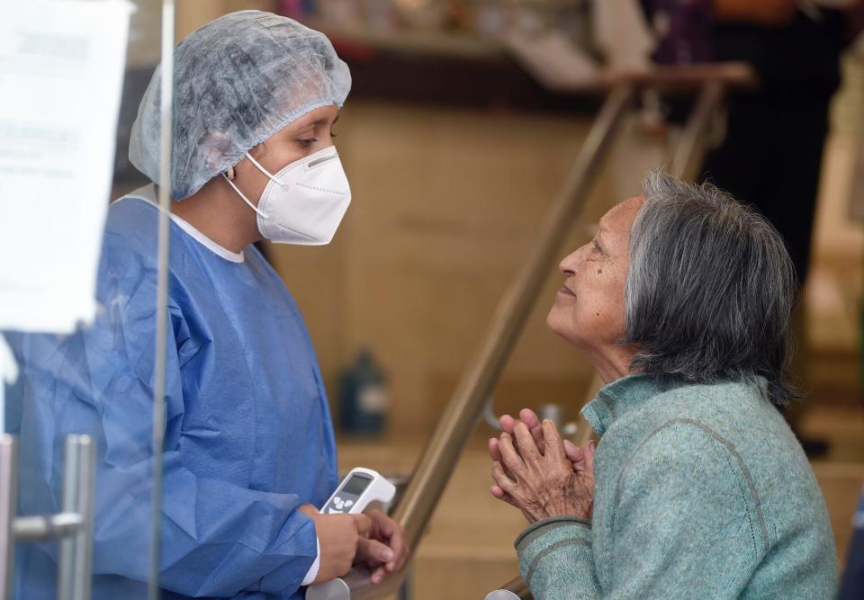 A nurse listens to relative of patient hospitalized at the Tacuba General Hospital in Mexico City in April.