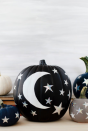 <p>Recreate the perfect night sky with a black painted pumpkin and a handful of <a href="https://www.amazon.com/Kenkio-Stickers-Colorful-Adhesive-Decoration/dp/B0912Z9R4B/?tag=syn-yahoo-20&ascsubtag=%5Bartid%7C10052.g.38066841%5Bsrc%7Cyahoo-us" rel="nofollow noopener" target="_blank" data-ylk="slk:gold and silver star stickers;elm:context_link;itc:0;sec:content-canvas" class="link ">gold and silver star stickers</a>. This pumpkin look is ideal for those who prefer to stay away from gory Halloween decor.<br><br>Get the tutorial at <a href="https://ohsobeautifulpaper.com/2017/10/diy-moon-and-stars-pumpkins/" rel="nofollow noopener" target="_blank" data-ylk="slk:Oh So Beautiful Paper.;elm:context_link;itc:0;sec:content-canvas" class="link ">Oh So Beautiful Paper.</a></p>