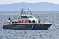 A Hellenic Coast Guard vessel carrying the bodies of migrants that were drowned when the small boat they were travelling on capsized near the island of Agathonisi, approaches the port of Pythagoreio on the island of Samos, Greece, March 17, 2018. SamosTimes.gr via REUTERS