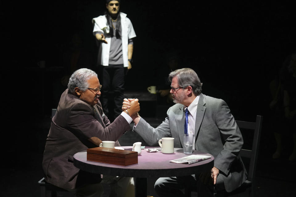 This image shows Count Sovall, left, and John L. Payne during a performance of "American Rot," playing through March 31 at the Ellen Stewart Theatre in New York. (Steven Pisano/Sam Rudy Public Relations via AP)