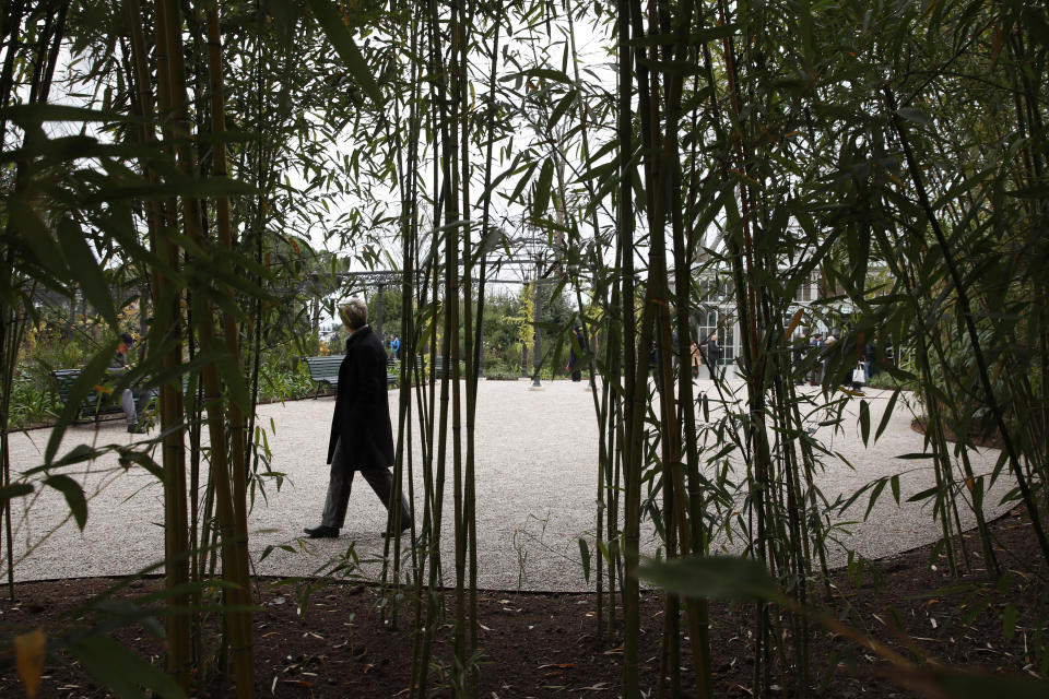 A woman visits the newly restored Royal Gardens in Venice, Italy, Tuesday, Dec. 17, 2019. Venice’s Royal Gardens were first envisioned by Napolean, flourished under Austrian Empress Sisi and were finally opened to the public by the Court of Savoy, until falling into disrepair in recent years. After an extensive restoration, the gardens reopened Tuesday as a symbol both of the lagoon city’s endurance and the necessity of public-private partnerships to care for Italy’s extensive cultural heritage. (AP Photo/Antonio Calanni)