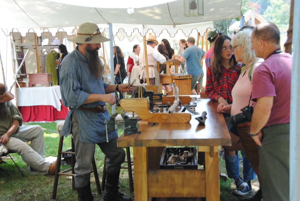 Demonstrators explain their craft to visitors at Mountain Craft Days at the Somerset Historical Center.