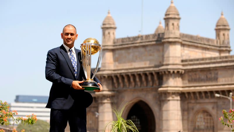 India's captain Dhoni lifts the trophy at the Taj hotel the day after India defeated Sri Lanka in the ICC Cricket World Cup final in Mumbai