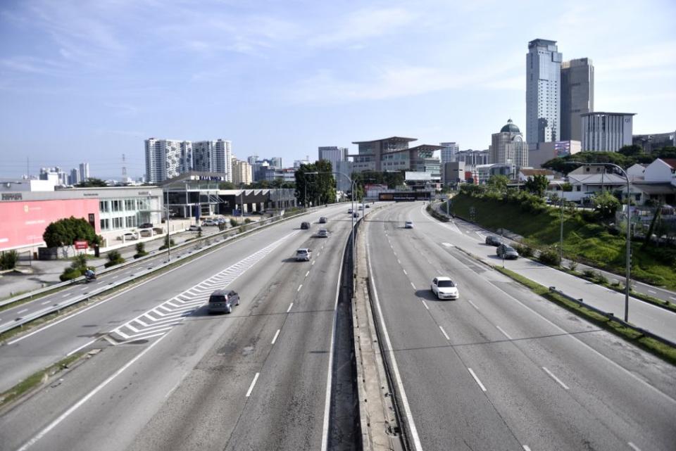 A general view of traffic on the Federal Highway in Petaling Jaya Kuala Lumpur as the movement control order kicks in on March 18, 2020. — Picture by Miera Zulyana