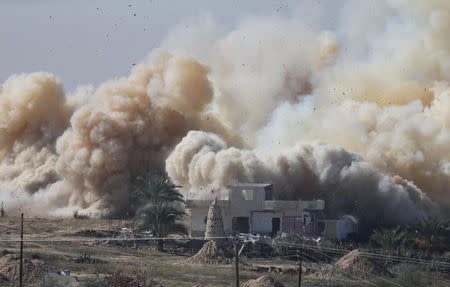 Smoke rises as a house is blown up during a military operation by Egyptian security forces in the Egyptian city of Rafah, near the border with southern Gaza Strip November 6, 2014. REUTERS/Ibraheem Abu Mustafa