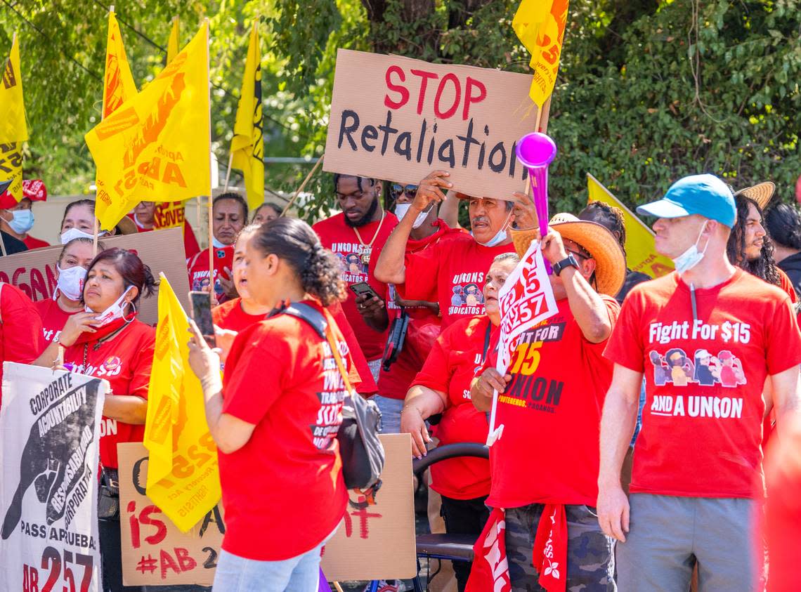 Protesters line up outside of a McDonald’s in North Highlands to show their support for a California bill that will strengthen fast food workers’ rights, on Tuesday.