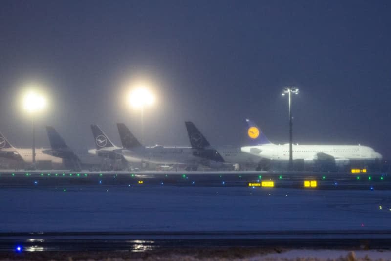 Several Lufthansa aircraft parked at Frankfurt Airport after many flights were canceled due to bad weather conditions. Lando Hass/dpa