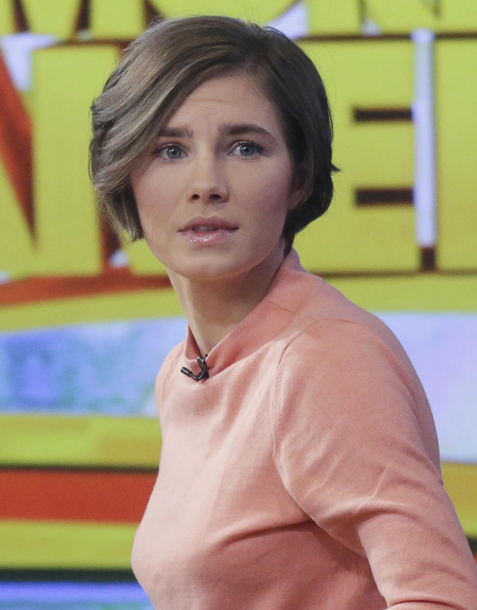 Amanda Knox prepares to leave the set following a television interview, Friday, Jan. 31, 2014 in New York. To many Americans, especially in her hometown of Seattle, Amanda Knox seems the victim, unfairly hounded by a capricious foreign legal system for the death of a 21-year-old British woman. But in Italy and elsewhere in Europe, others see her as someone who got away with murder, embroiled in a case that continues to make global headlines and reinforces a negative image of Americans behaving badly _ even criminally _ abroad without any punishment. As she remains free in the U.S., these perceptions will not only fuel the debate about who killed Meredith Kercher in 2007 and what role, if any, Knox played in her death, but also about whether U.S. authorities should, if asked, send her to Italy to face prison. (AP Photo/Mark Lennihan)